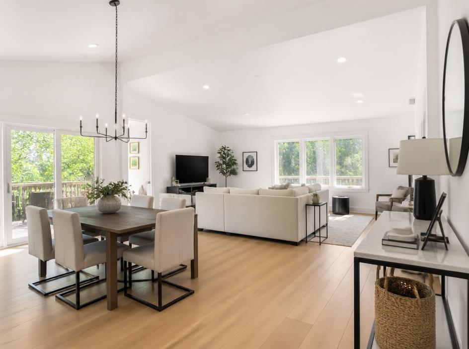 Bright open-concept living and dining space after renovation